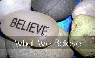 Photo of a rock with the word "Believe" on it