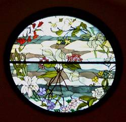 Nature themed stained glass windows all depict flowers mentioned in the bible.