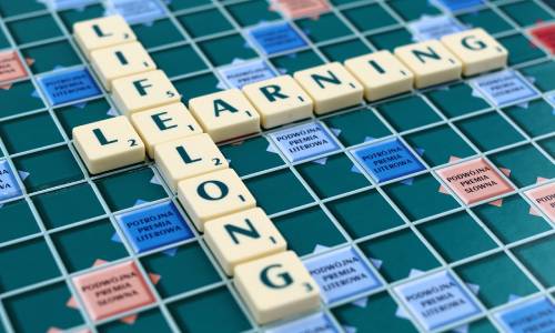 photo of a Scrabble board showing the words "Lifelong Learning"