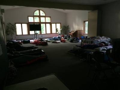 picture of all the youth sleeping in fellowship hall of the church.